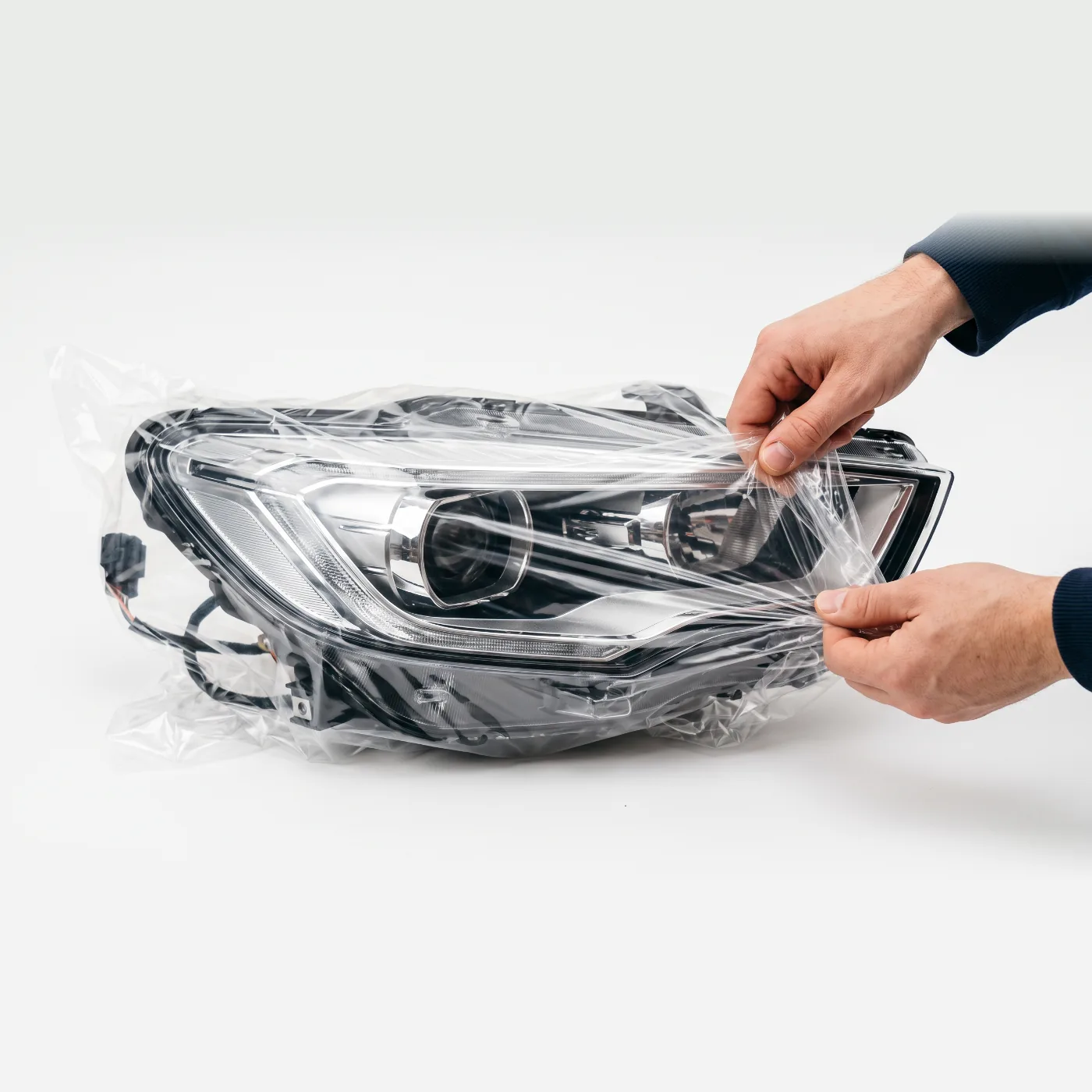Car headlamp in a clear PE bag