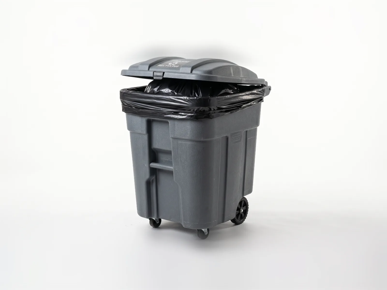 Black trash bag lining a wheeled bin